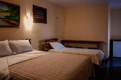 Uma cama ou camas num quarto em Hotel Alta Vista