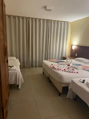 Uma cama ou camas num quarto em AP 05 com Jacuzzi - Sol e Mar Residence Be Summer