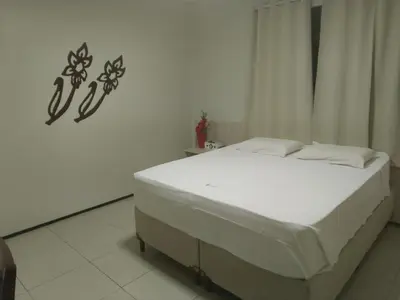 Uma cama ou camas num quarto em Hotel Visconde