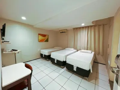 Uma cama ou camas num quarto em Hotel Visconde