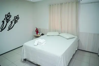 Uma cama ou camas num quarto em Hotel Visconde