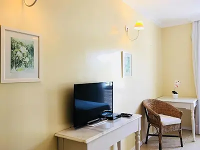 Uma televisão e/ou sistema de entretenimento em Hotel Montenegro Guaramiranga