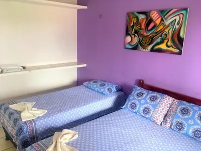 Uma cama ou camas num quarto em Pousada Brilho da Lua