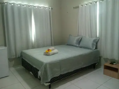 Uma cama ou camas num quarto em Residence Delux Flecheiras