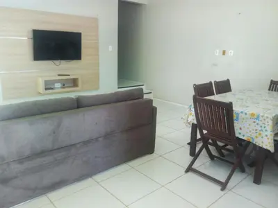 Uma televisão e/ou sistema de entretenimento em Residence Delux Flecheiras