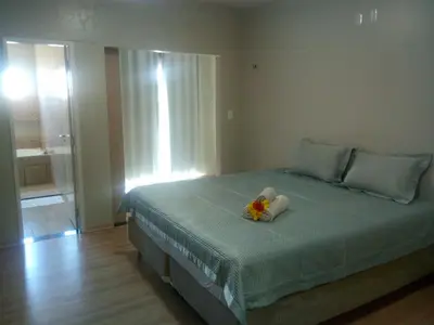 Uma cama ou camas num quarto em Residence Delux Flecheiras