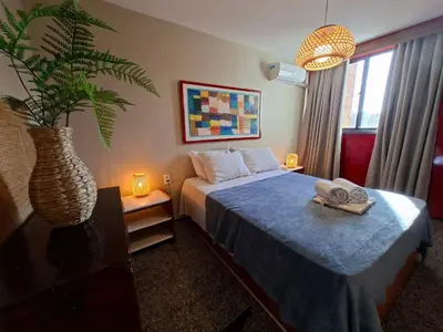 Uma cama ou camas num quarto em Flat Atlântico Meireles by Escala