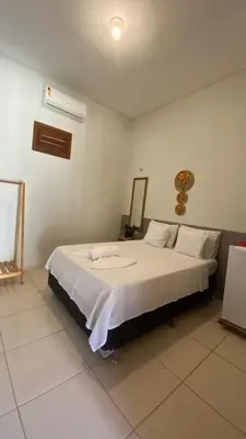 Uma cama ou camas num quarto em Beach Chalet Preá