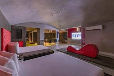 Uma cama ou camas num quarto em Spa urbano Motel Adult Only