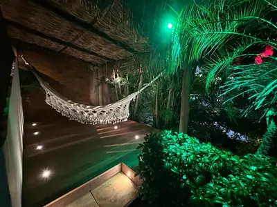 Um jardim no exterior de Pousada Oasis Paracuru