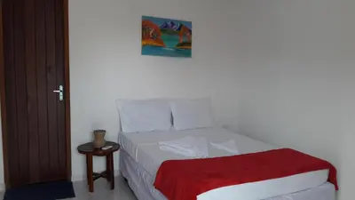 Uma cama ou camas num quarto em Villa Portal dos Ventos