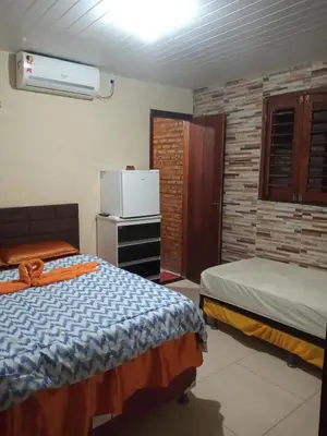 Uma cama ou camas num quarto em Pousada Recanto das Fontes