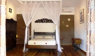 Uma cama ou camas num quarto em Pousada O Refúgio