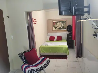 Uma cama ou camas num quarto em Cantinho Morro Branco
