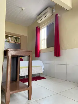 Uma cama ou camas num quarto em Cantinho Morro Branco
