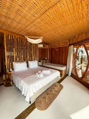 Uma cama ou camas num quarto em BAMBU BLU Lagoon Homes - Ilha do Guajiru