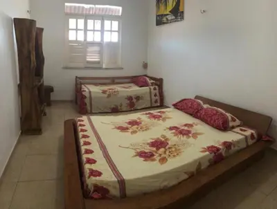 Uma cama ou camas num quarto em Mansão Triplex 10 Suítes a 150 metros do Mar e Beach Park