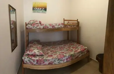 Uma cama ou camas num quarto em Mansão Triplex 10 Suítes a 150 metros do Mar e Beach Park
