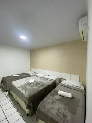 Uma cama ou camas num quarto em Hotel Pousada Villa Marina
