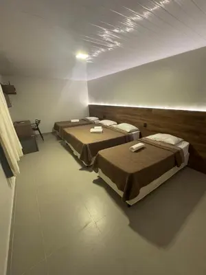 Uma cama ou camas num quarto em Hotel Pousada Villa Marina
