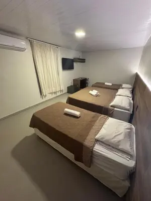 Uma cama ou camas num quarto em Hotel Pousada Villa Marina