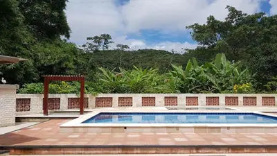 A piscina em ou perto de HOTEL CANTINHO DAS FLORES
