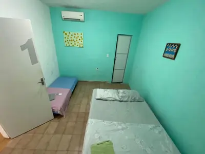 Uma cama ou camas num quarto em Sol'Lar Pousada & Hostel