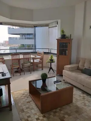 Uma área de estar em Flat Beira Mar Golden Fortaleza