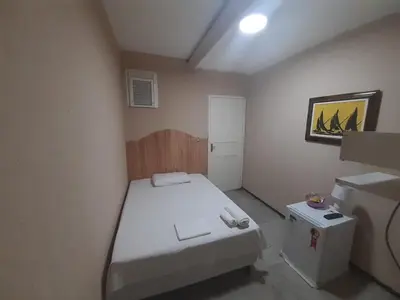 Uma cama ou camas num quarto em Hotel Nacional