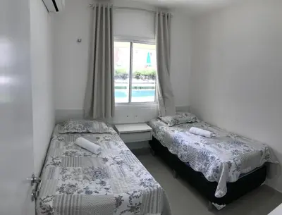 Uma cama ou camas num quarto em Vg Fun - Frente Mar! No melhor da praia do futuro