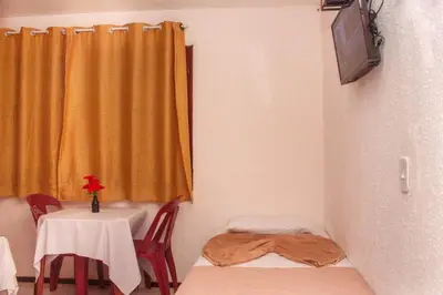Uma televisão e/ou sistema de entretenimento em Pousada de serra TUTUCA