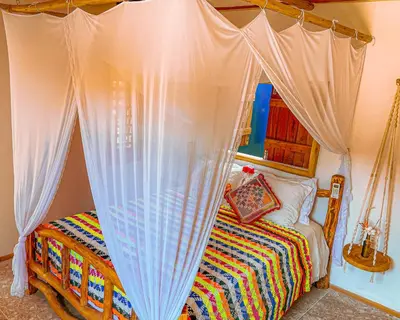 Uma cama ou camas num quarto em Pousada Quinta da Lagoa Azul