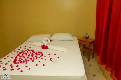 Uma cama ou camas num quarto em Pousada aconcheg'us