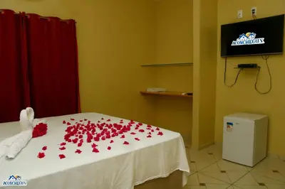 Uma televisão e/ou sistema de entretenimento em Pousada aconcheg'us