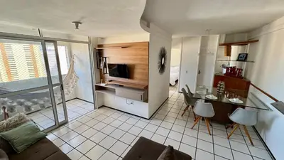 Uma televisão e/ou sistema de entretenimento em Apartamento Praia de Iracema com vista mar