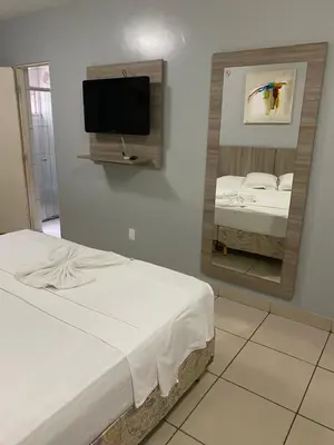 Uma cama ou camas num quarto em Hotel Fortaleza Inn