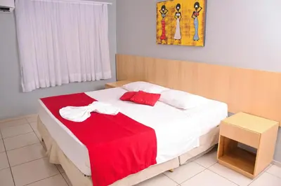 Uma cama ou camas num quarto em Hotel Fortaleza Inn