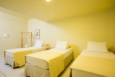 Uma cama ou camas num quarto em Nordeste Palace Hotel - Fortaleza