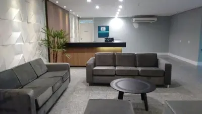 Uma área de estar em Hotel Flat Atlântico