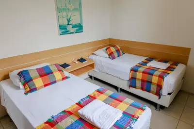 Uma cama ou camas num quarto em Atlantic Palace Apart-Hotel