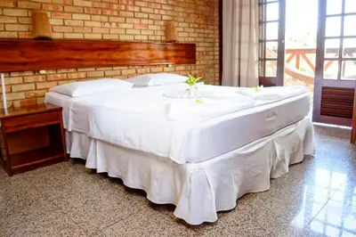 Uma cama ou camas num quarto em Hotel Vento Brasil