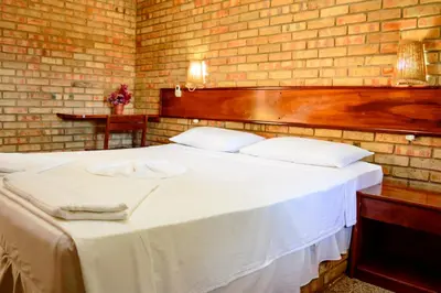 Uma cama ou camas num quarto em Hotel Vento Brasil