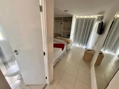 Uma cama ou camas num quarto em GranSol, Terreo, Pé na areia, 03 qtos, 08 adultos e 02 crianças, a 600m do B PARK