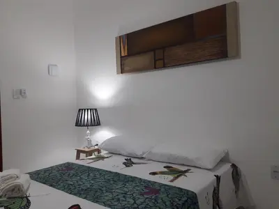 Uma cama ou camas num quarto em Villa Arte Pousada Morro Branco