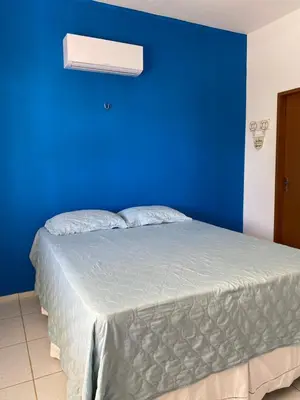 Uma cama ou camas num quarto em Mansão Beberibe