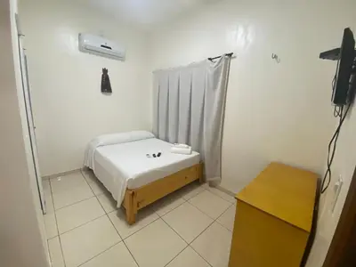 Uma cama ou camas num quarto em Pousada Casa da Cion