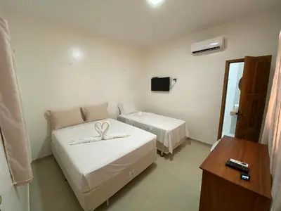 Uma cama ou camas num quarto em Pousada Casa da Cion
