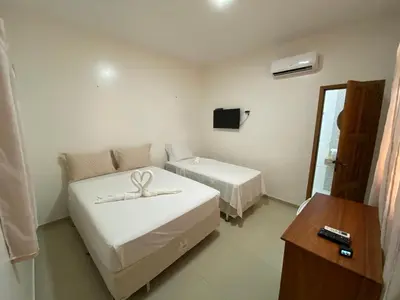 Uma cama ou camas num quarto em Pousada Casa da Cion