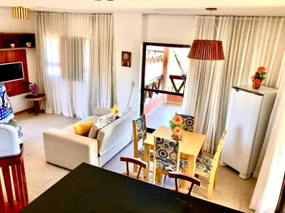 Uma televisão e/ou sistema de entretenimento em Cumbuco Dream Village Luxury Condo
