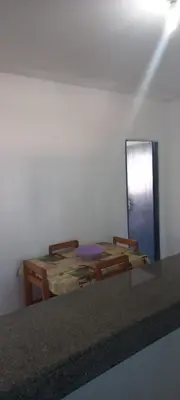 Uma área de estar em Porto Canoa Apartamento